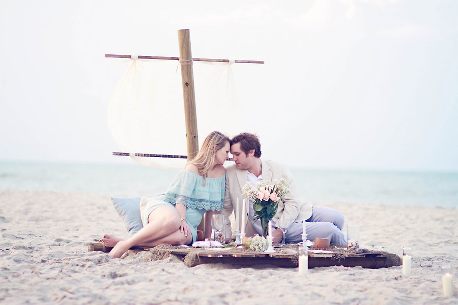Sunrise Shipwrecked Raft Surprise Engagement Session With All The Elegant Beachy Touches