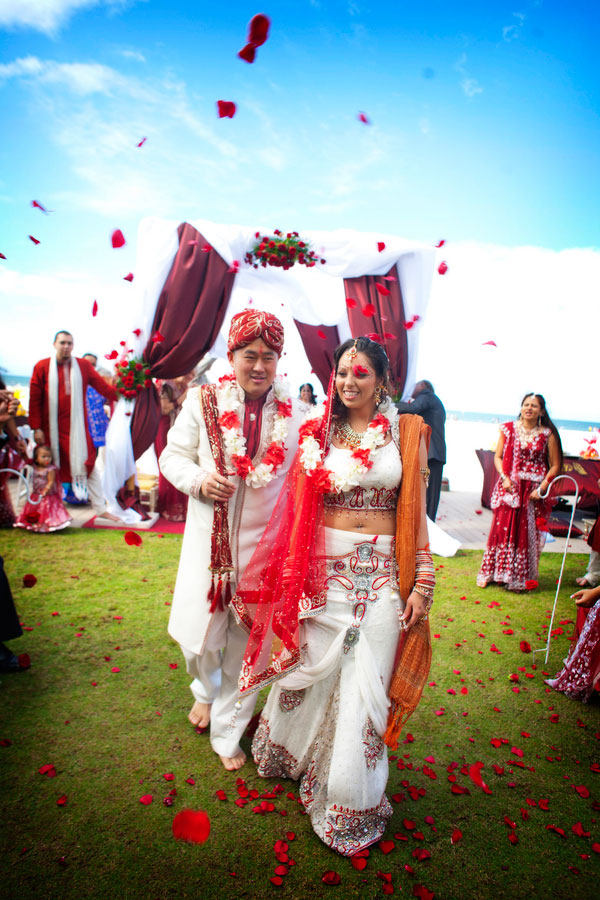 Dual Faith Buddhist Hindu Wedding In Bold Red & Bright Metallics Along The Sands Of Clearwater Florida