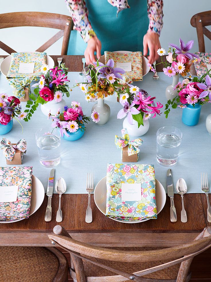 Wood Table Setting With Floral Accents via Thuss + Farrell